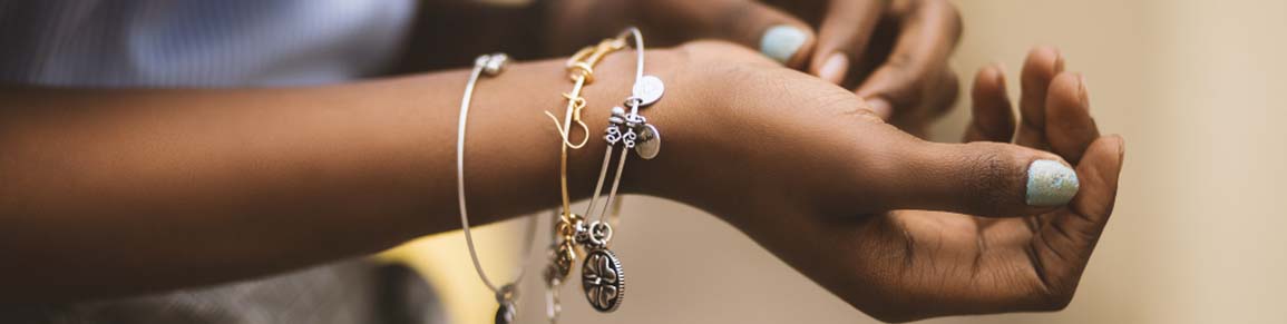 woman wearing stacked bracelets